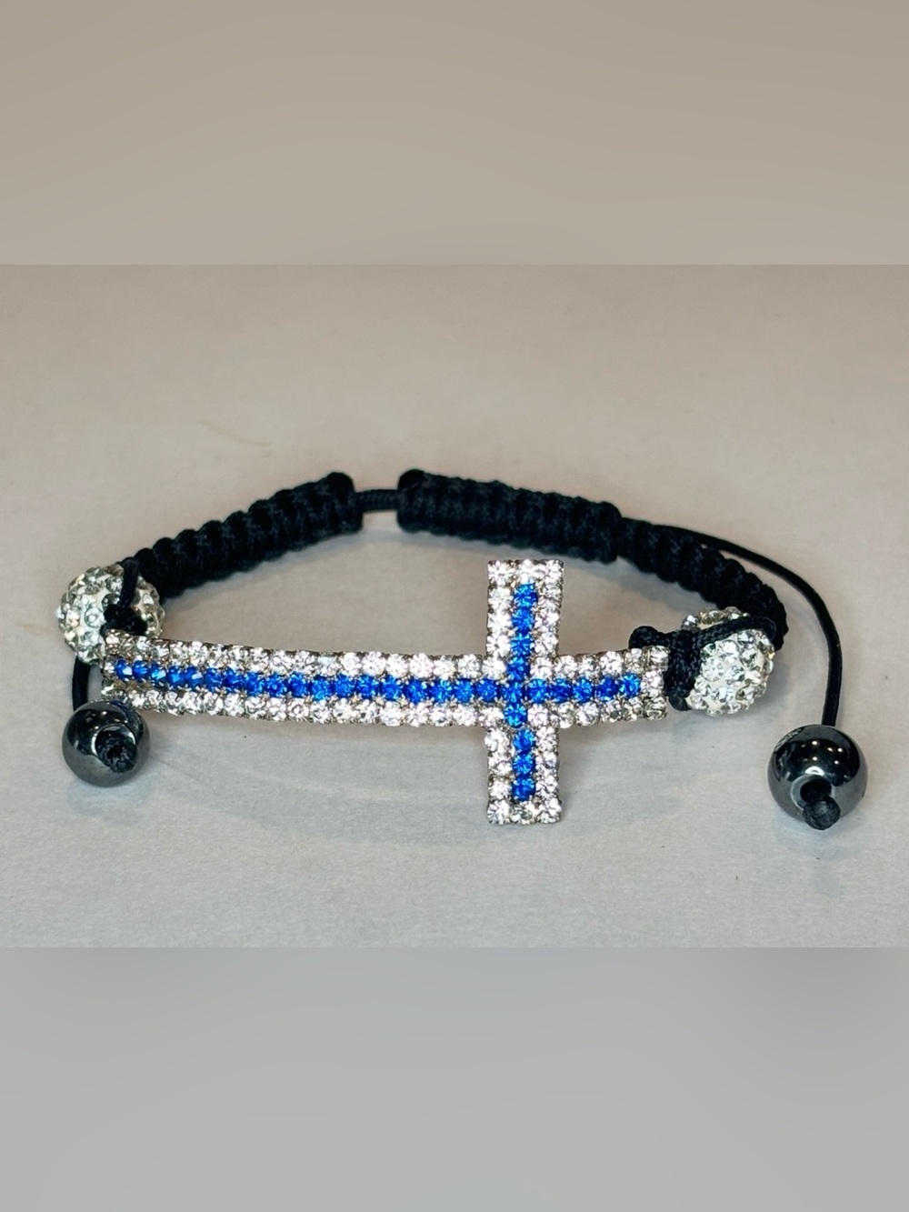 Sideways Cross Bracelet Blue Clear Glass Rhinestones Adjustable Black Cord